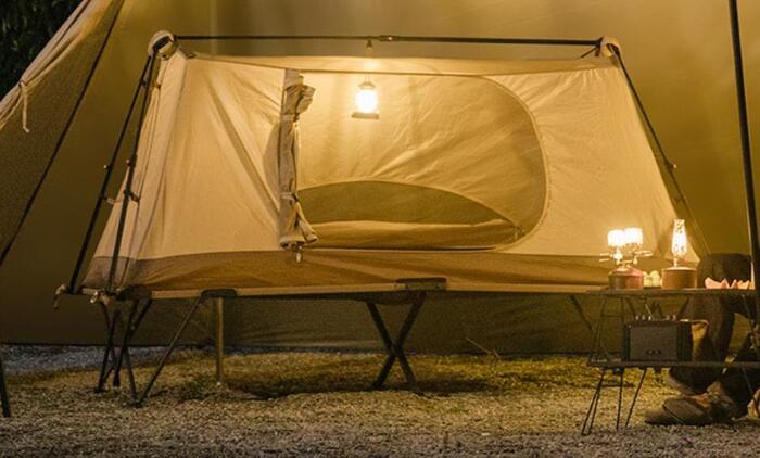 The inner tent and cot used in a larger tent.